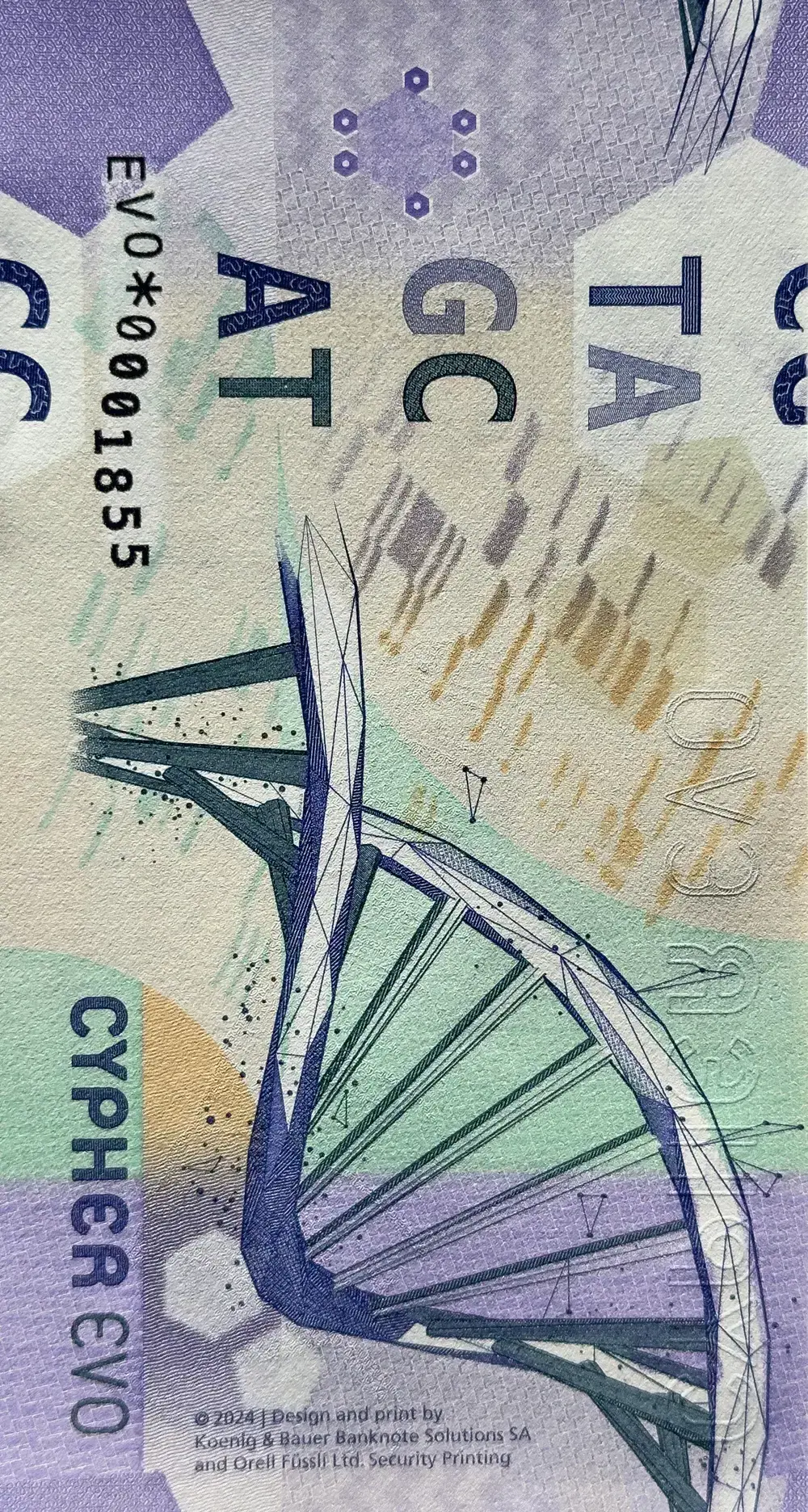 The backside of a banknote showing base pairs as letters and a helix-shaped DNA strand printed on a purple, sand and mint colored abstract background.